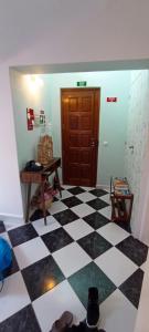 a room with a black and white checkered floor at Zawaiaroom in Lagos +45 photos