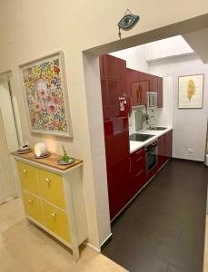 a kitchen with a red refrigerator and a counter at Feel at home - Self Check In in Vienna