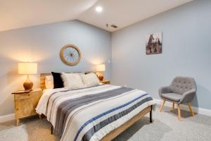 a bedroom with a bed and a chair at Walk to Lake Hiram Hideaway with Shared Gazebo! in Hiram