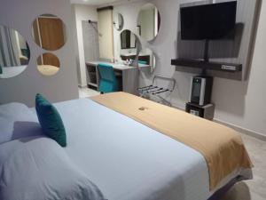 Postel nebo postele na pokoji v ubytování Hotel Yahalis