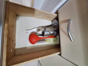 a cupboard with a blow dryer and tools in it at Bahía x día 1 in Bahía Blanca