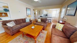 a living room with two couches and a coffee table at Family Time by Tybee Vacation Rentals in Tybee Island +58 photos
