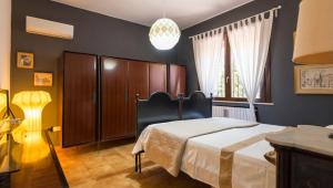 Un pat sau paturi într-o cameră la Villa Marcella - Riserva del Plemmirio Wifi