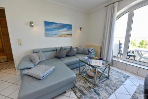 Ein Sitzbereich in der Unterkunft "Appartementhaus Deichgraf" Appartement D445