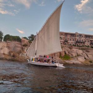 a group of people on a sail boat on the water at ABU Guest House in Aswan