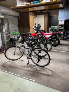 a group of bikes parked in a parking lot at Minpaku KEN HOUSE - Vacation STAY 60948v in Nagahama
