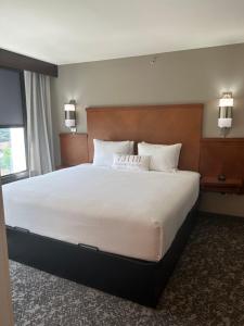 a large bed in a hotel room at The Winslow - Oklahoma City in Oklahoma City