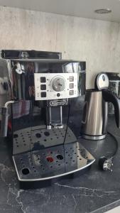 a coffee maker sitting on top of a counter at Feriehuset Holmen in Straumen