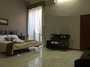 Posteľ alebo postele v izbe v ubytovaní Soggiorno Paradiso
