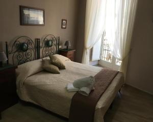 Posteľ alebo postele v izbe v ubytovaní Soggiorno Paradiso