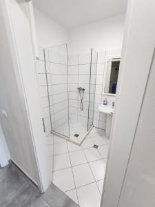 a bathroom with a shower and a sink at holiday shengjin kune in Shëngjin +106 photos