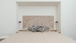 En eller flere senge i et værelse på Dammuso Alkibar + 65 billeder