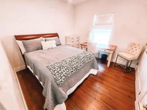a bedroom with a bed and a desk and a chair at Pet Friendly Rancher Brand New on 40 Acres in Leadville