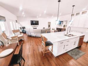 a kitchen and living room with a table and a couch at Pet Friendly Rancher Brand New on 40 Acres in Leadville