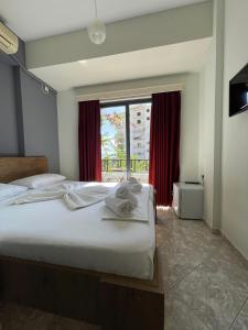 Postel nebo postele na pokoji v ubytování Privé City Hotel