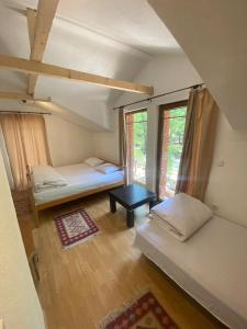 Postel nebo postele na pokoji v ubytování STANET Forest Houses
