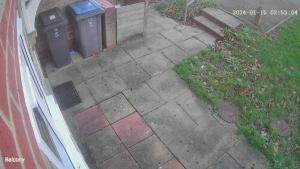 an aerial view of a sidewalk with two trash cans at Cosy furnished double room in a great quiet location walking distance to seaside and town in Kent
