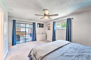 a bedroom with a bed and a ceiling fan at Day Trip to Disney and Beach Home with Saltwater Pool in Deltona +20 photos