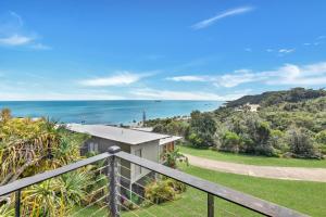 an ocean view from the balcony of a house at Marlin Lodge in Tangalooma