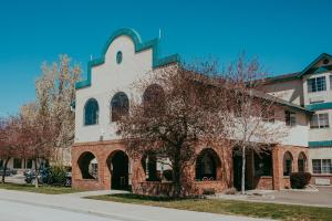 a red brick building with a church at Carson City Plaza Hotel in Carson City