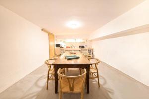 a dining room with a table and chairs at Hostal Bonanza in Sitges