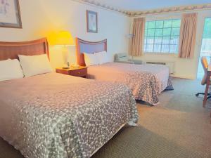 Postel nebo postele na pokoji v ubytování Northgate Inn
