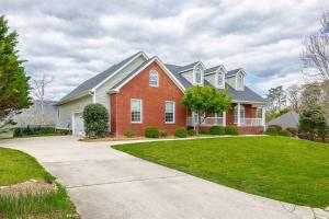 a large house with a red brick at Pickleball - Pool - Hot Tub - Gym - BBQ in Cenchat