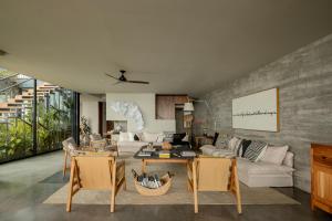 a living room with a couch and a table at Casa Borrega, Luxury and Design in Higuera Blanca