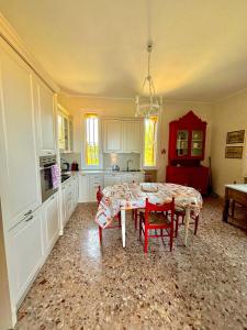 a kitchen with a table and chairs in a room at Villa Incina - Sea House in Polignano a Mare