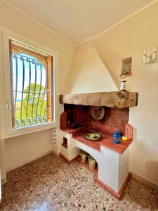 a kitchen with a pretend stove in a room at Villa Incina - Sea House in Polignano a Mare