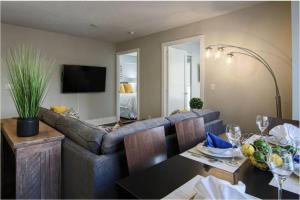 a living room with a couch and a table at Residence Inn by Soho in Toronto