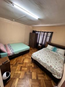 Llit o llits en una habitació de Hostal Nauu