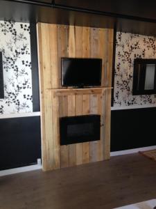 TV in/ali zabaviščno središče v nastanitvi Manoir Charlevoix
