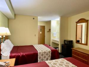 a hotel room with two beds and a sink at Hunter Lodge in Ripley