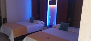 Postel nebo postele na pokoji v ubytování Hotel Yahalis