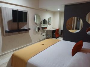 Postel nebo postele na pokoji v ubytování Hotel Yahalis