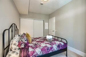 a bedroom with a bed with a colorful blanket at Condo in the heart of Downtown Toronto! in Toronto