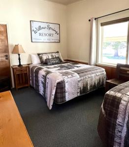 a bedroom with a bed and a window at Willow Springs Resort in Bridgeport