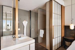 a bathroom with a sink and a shower at Shangri-La Nanning - The tallest hotel worldwide in Shangri-La Group in Nanning