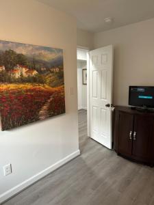 a living room with a painting on the wall at City access in Washington