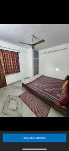 A bed or beds in a room at JAIPUR VIEW