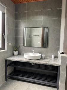 a bathroom with a sink and a mirror at AKIRA VILLA _ Venuestay in Ba Vì +20 photos