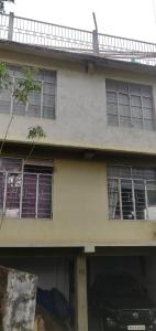 a house with a car parked in front of it at Mabie Homestay in Kohīma