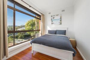Ένα ή περισσότερα κρεβάτια σε δωμάτιο στο Dusties 5 Pacific Street South West Rocks - Full Linen Provided
