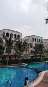 a large apartment building with a large swimming pool at Homestay CX 8 -163 in Hòa Bình