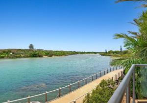 a view of a river from a bridge at Sunrise Cove Holiday Apartments by Kingscliff Accommodation in Kingscliff
