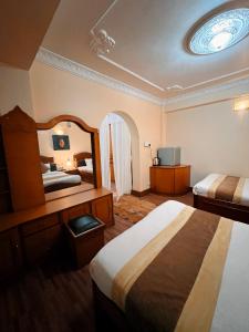 Llit o llits en una habitació de Hotel Bodhiz