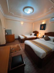 Llit o llits en una habitació de Hotel Bodhiz