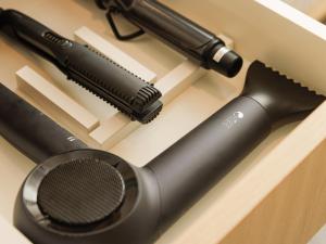 a hair dryer and a brush on a drawer at Y-HOTEL - Vacation STAY 32617v in Hiroshima