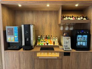 a bar with two coffee machines on a counter at Y-HOTEL - Vacation STAY 22330v in Hiroshima